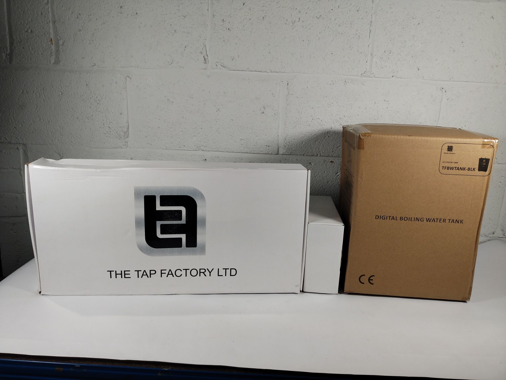 An as new The Tap Factory brushed steel kitchen tap (REF: TFHOTTAP9) and digital boiling water tank