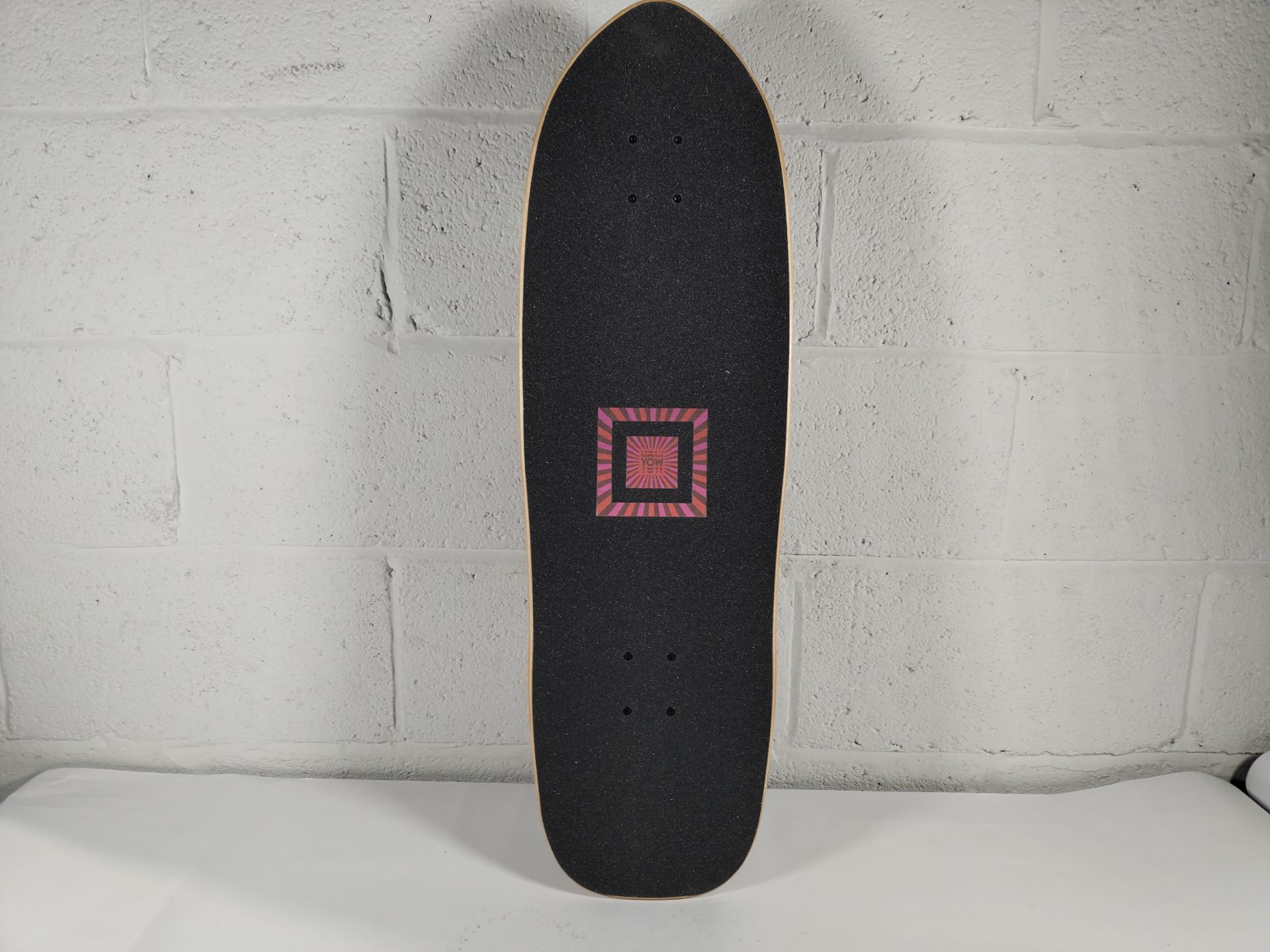 An as new Yow Snappers Julia Schimautz Surf skateboard, 32.5", black and pink.