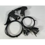 Two Shimano BR-RX810 Japan Callipers and two Shimano GRX brake levers (R, L).