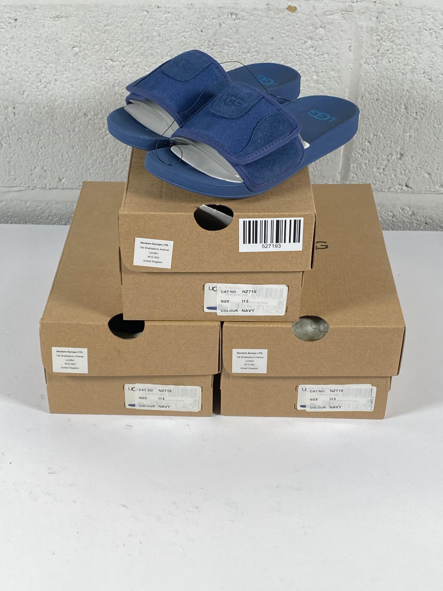 Three pairs of children's Ugg beach slide sandals (size 13).