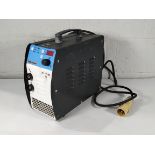 A pre-owned TIG- MAX XT 7110 Stainless Steel Cleaning Device with some accessories.