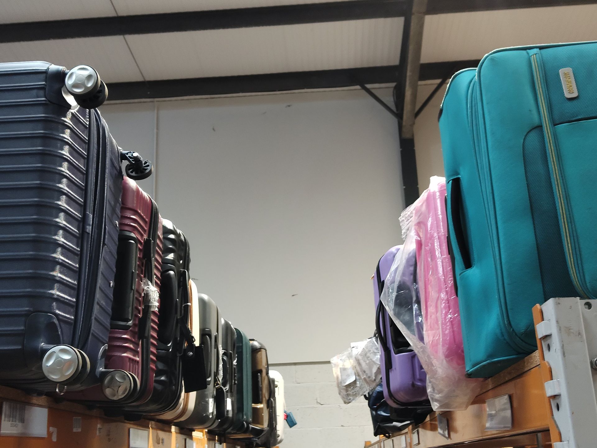 Thirty pre-owned travel suitcases/luggage bags, various colours, sizes and conditions.