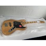 A boxed as new Squier Classic Vibe '70s Jazz Bass, natural (SN: ICSE25019875).