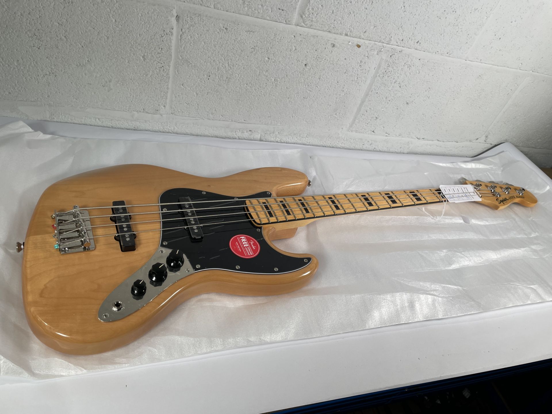 A boxed as new Squier Classic Vibe '70s Jazz Bass, natural (SN: ICSE25019875).