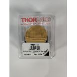 A Thorlabs MPD249-M03 - Ø2" 90° Off-Axis Parabolic Mirror, gold.