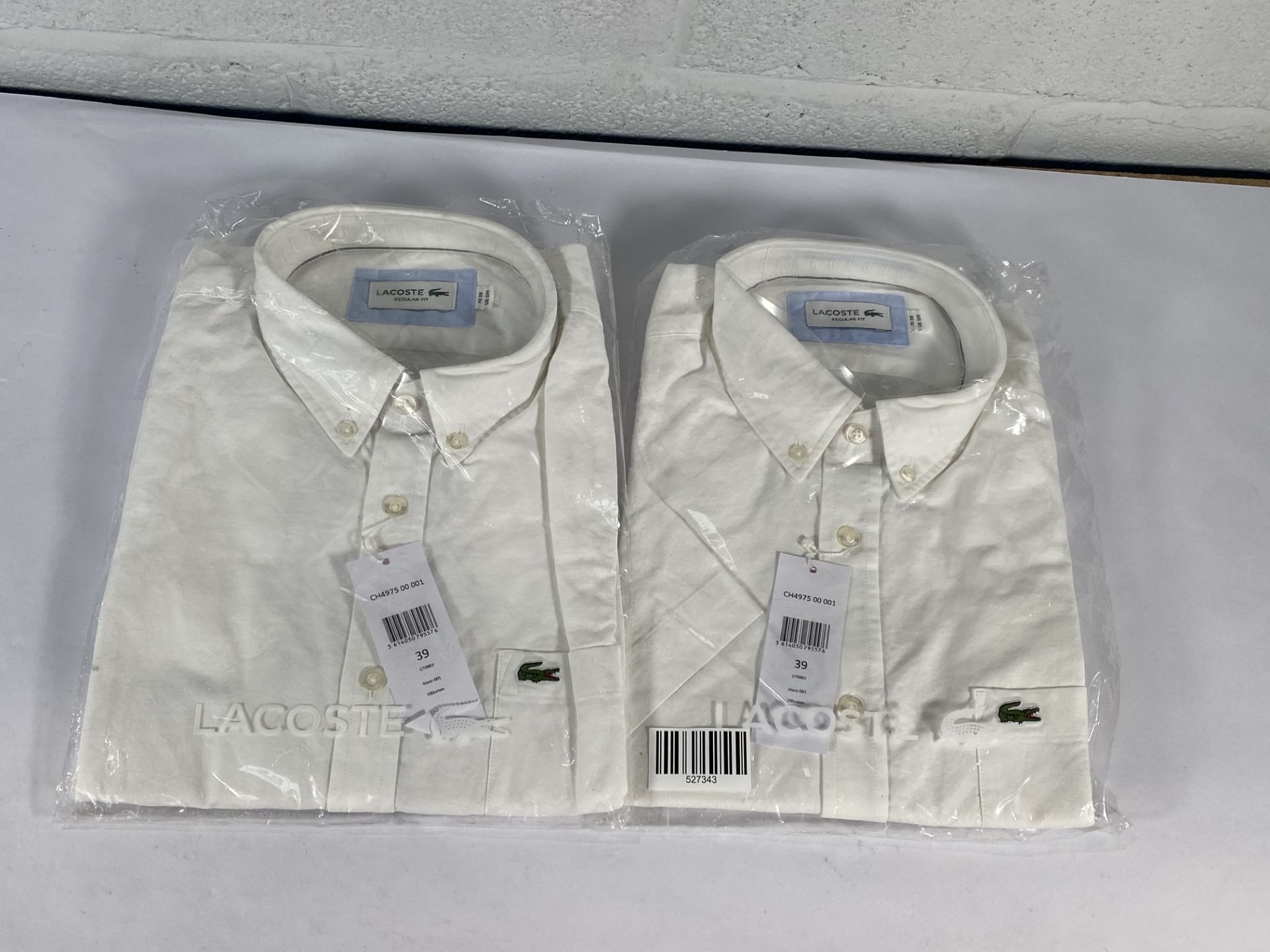 Two Lacoste regular fit shirts (Both size 39).