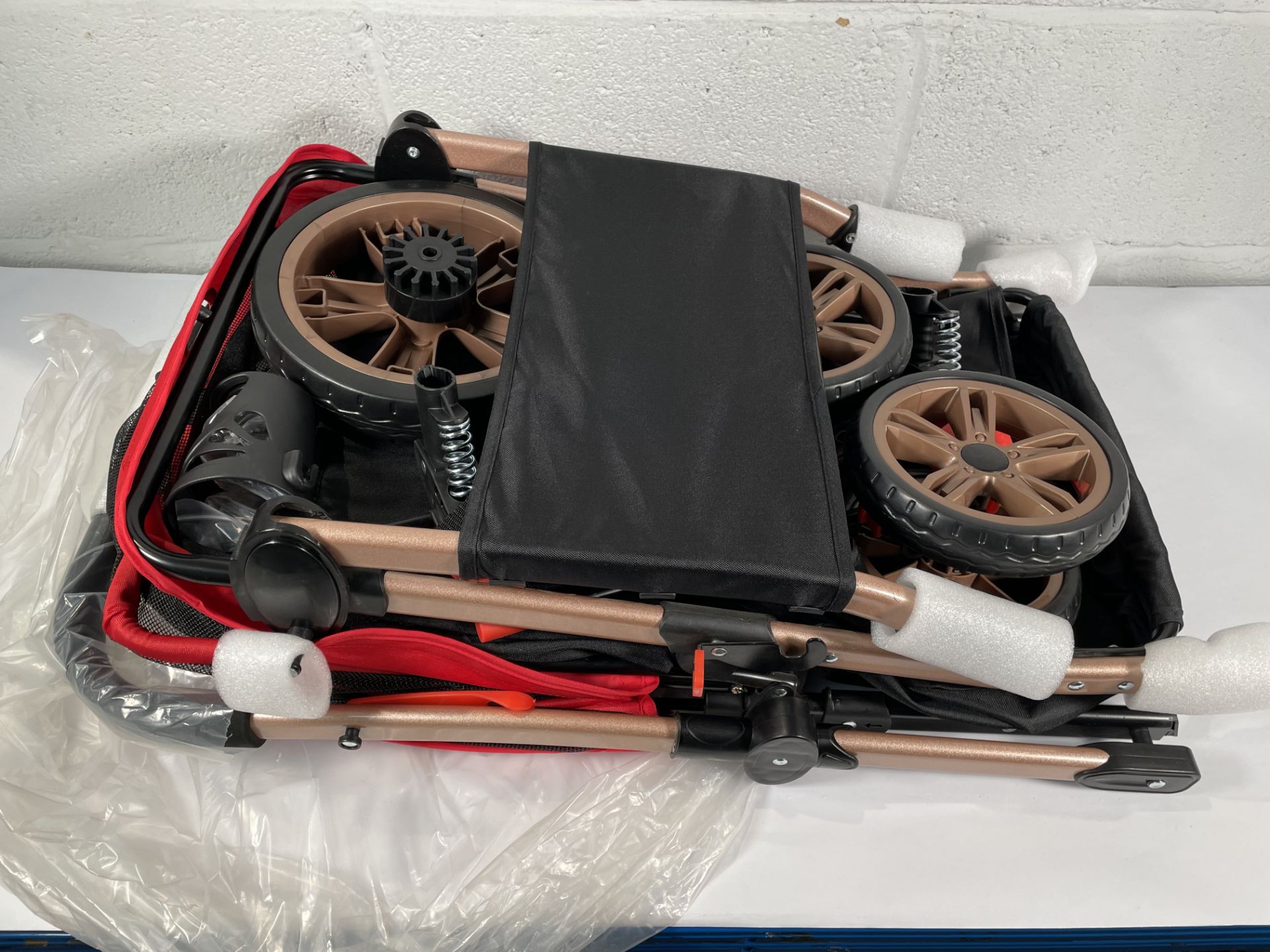 A Yitahome Pet Buggy with reversible handle (sold as seen).