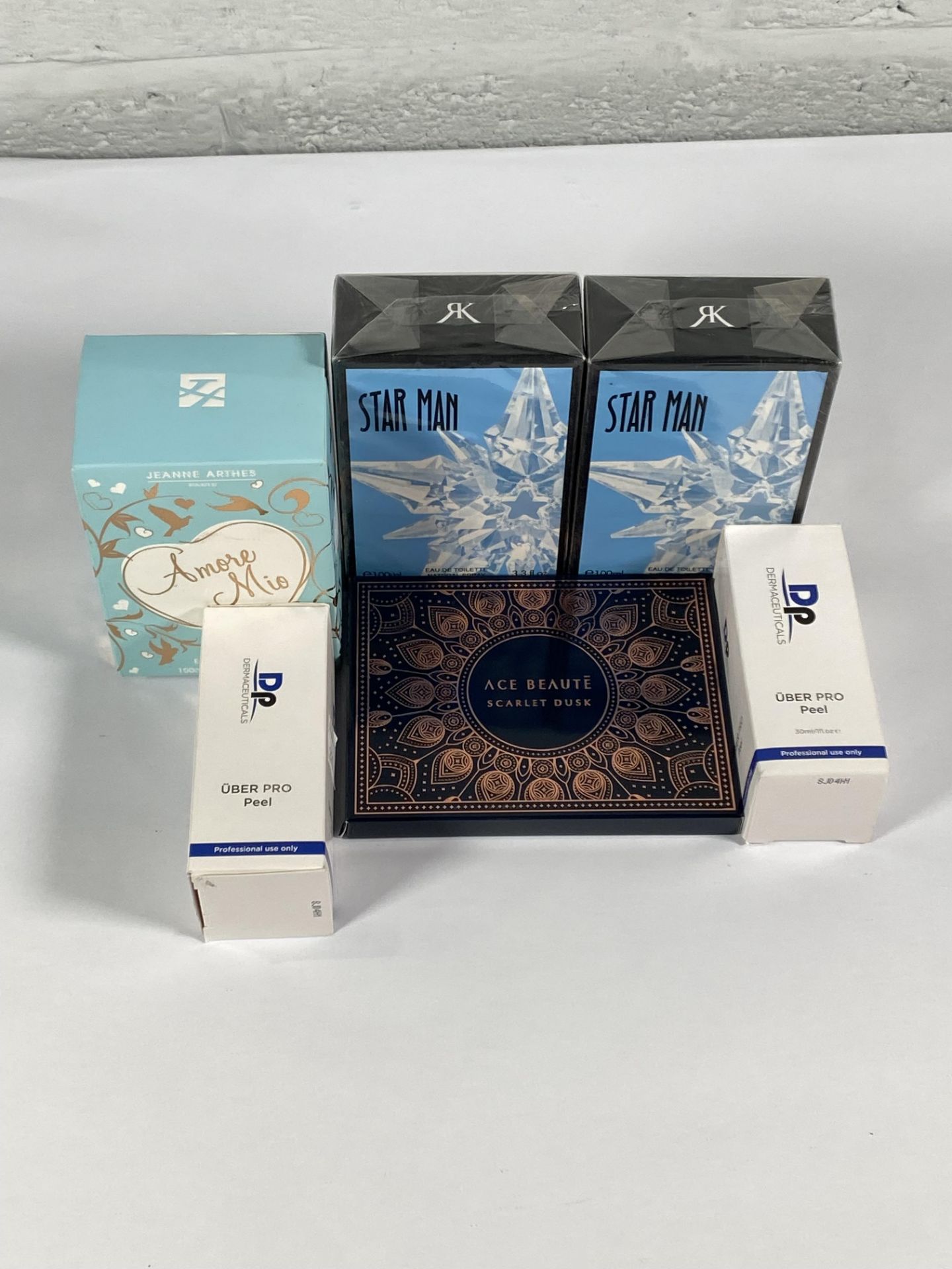 Six items of cosmetics and makeup to include perfumes, makeup pallet and serums.