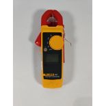A pre-owned Fluke 323 Clamp Meter (unit only).