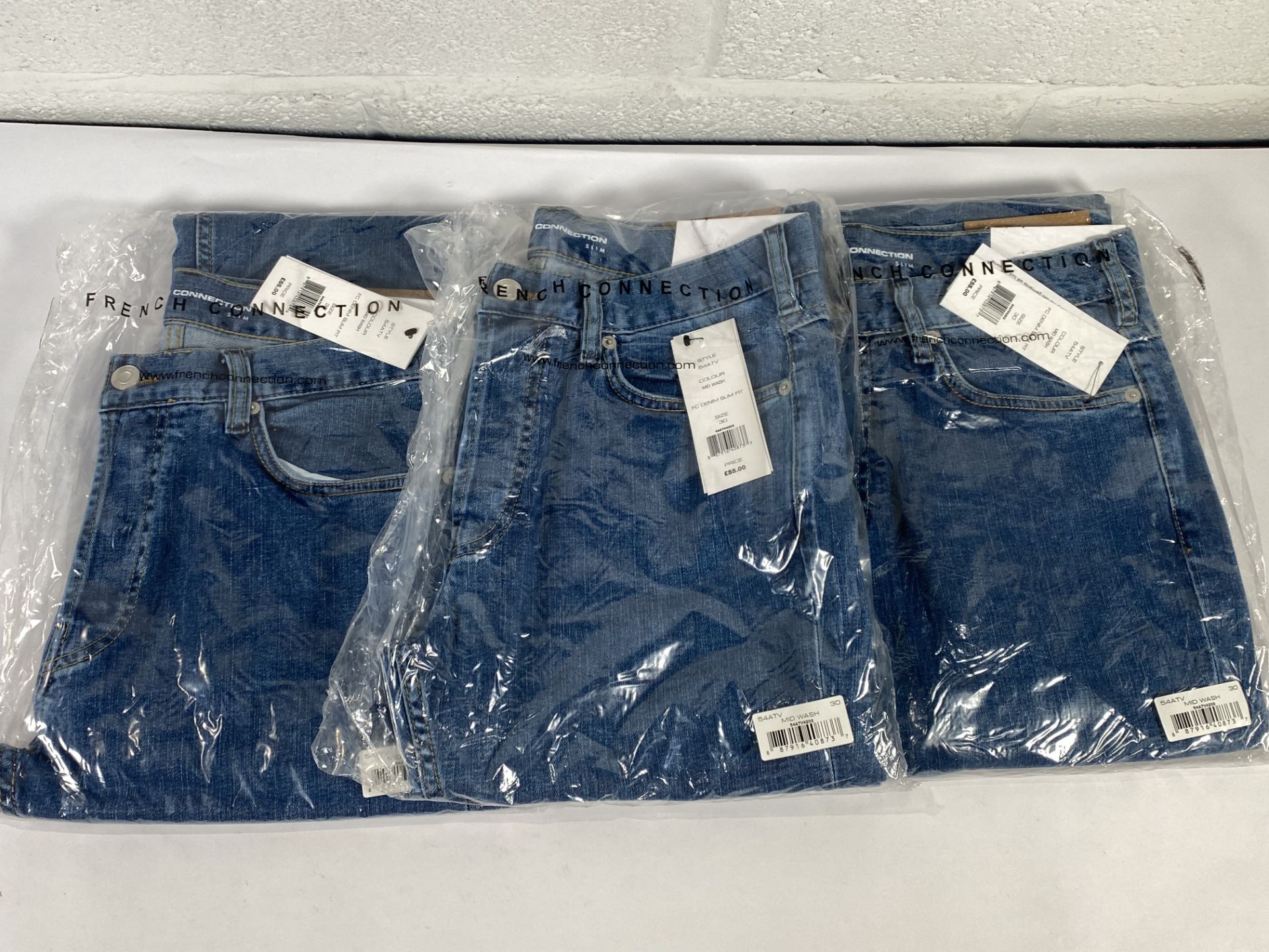 Three pairs of French Connection denim slim fit jeans (Sizes 32 and 30).