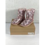 A pair of children's Ugg classic short 2 sequin star boots (UK 3).