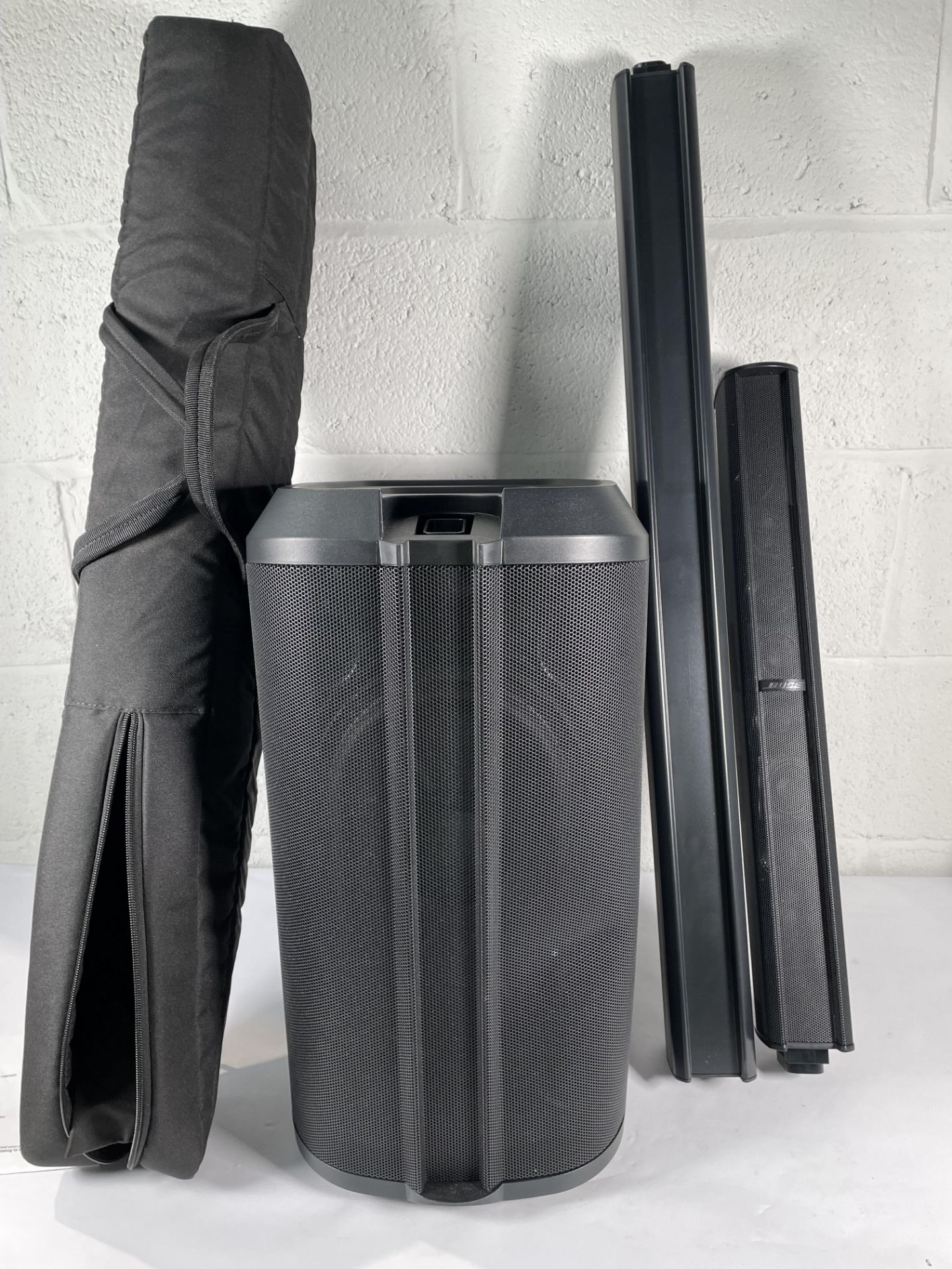 A pre-owned BOSE L1 Pro8 Portable Line Array System with some minor damage to front grill (includes