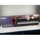An as new Yamaha portable keyboard (PSR EW320).