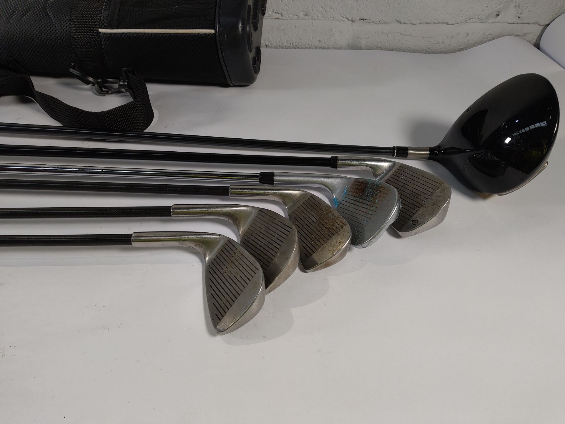 Six pre-owned golf clubs to include Taylor Made 425 driver.