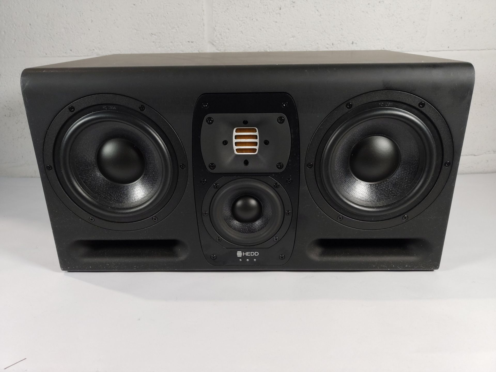 A pre-owned HEDD Type 30 active 3-way studio monitor.