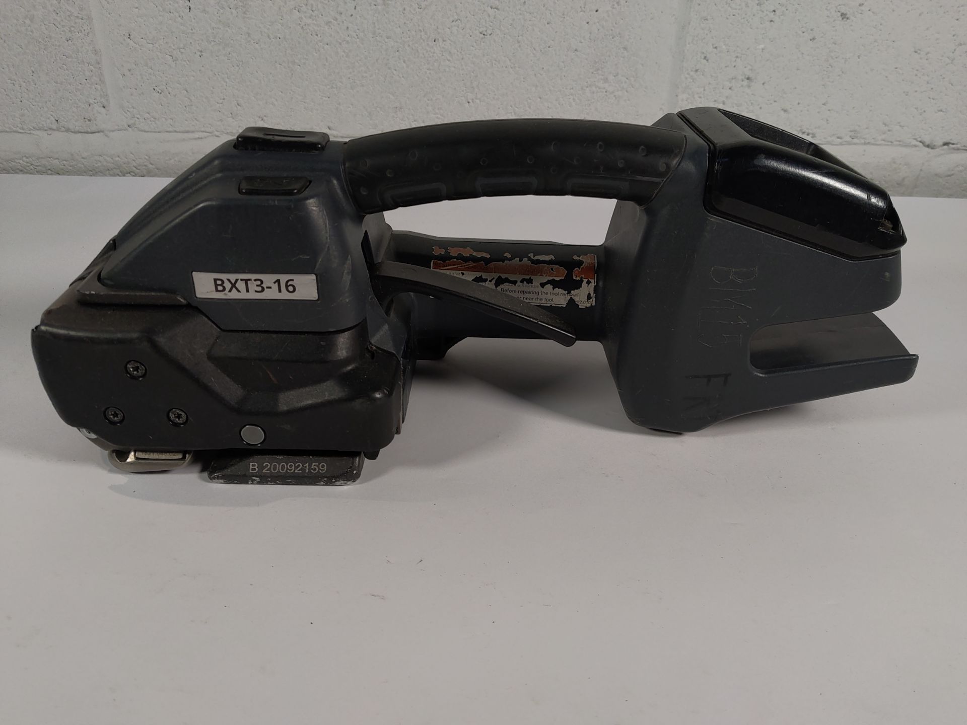 A pre-owned Signode BXT3-16 Strapping Tool (NO BATTERY).