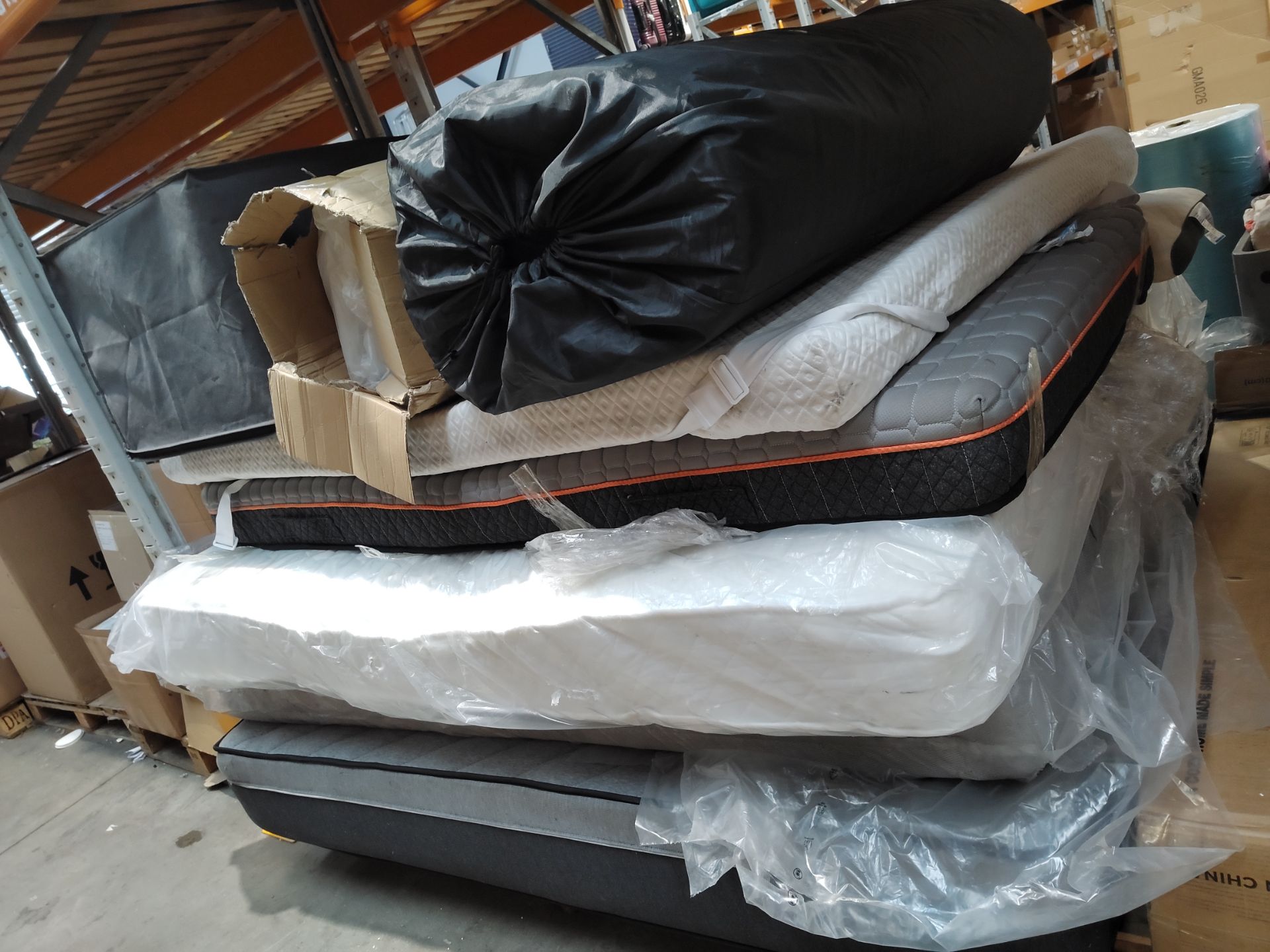 Seven assorted mattresses and toppers, sizes unknown.