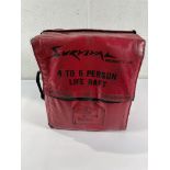 A pre-owned 4 to 6 Person Life Raft (sold as seen).