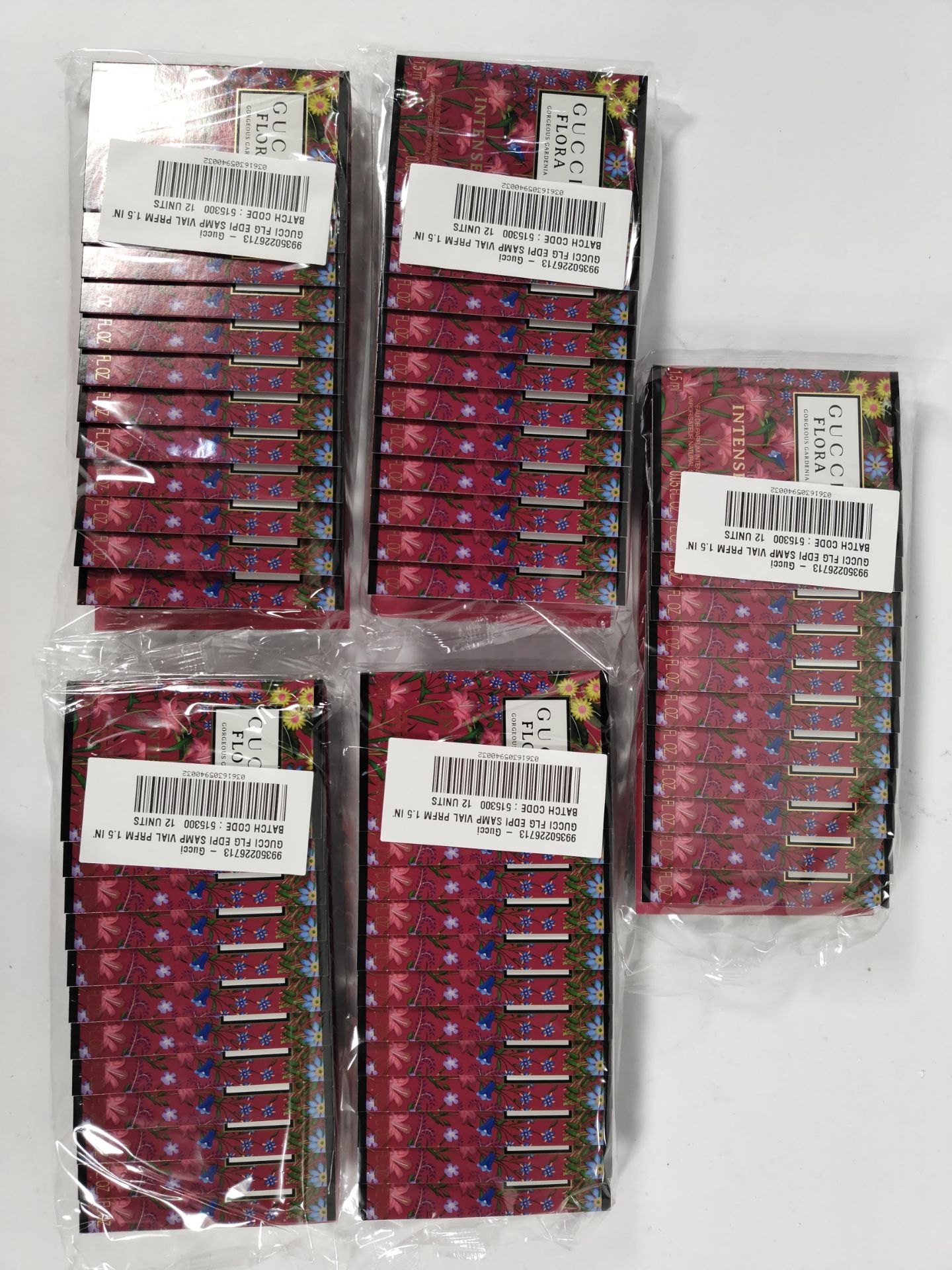 Five packs of Gucci Flora Intense 1.5ml EDP fragrance vials (12 per pack - 60 total).