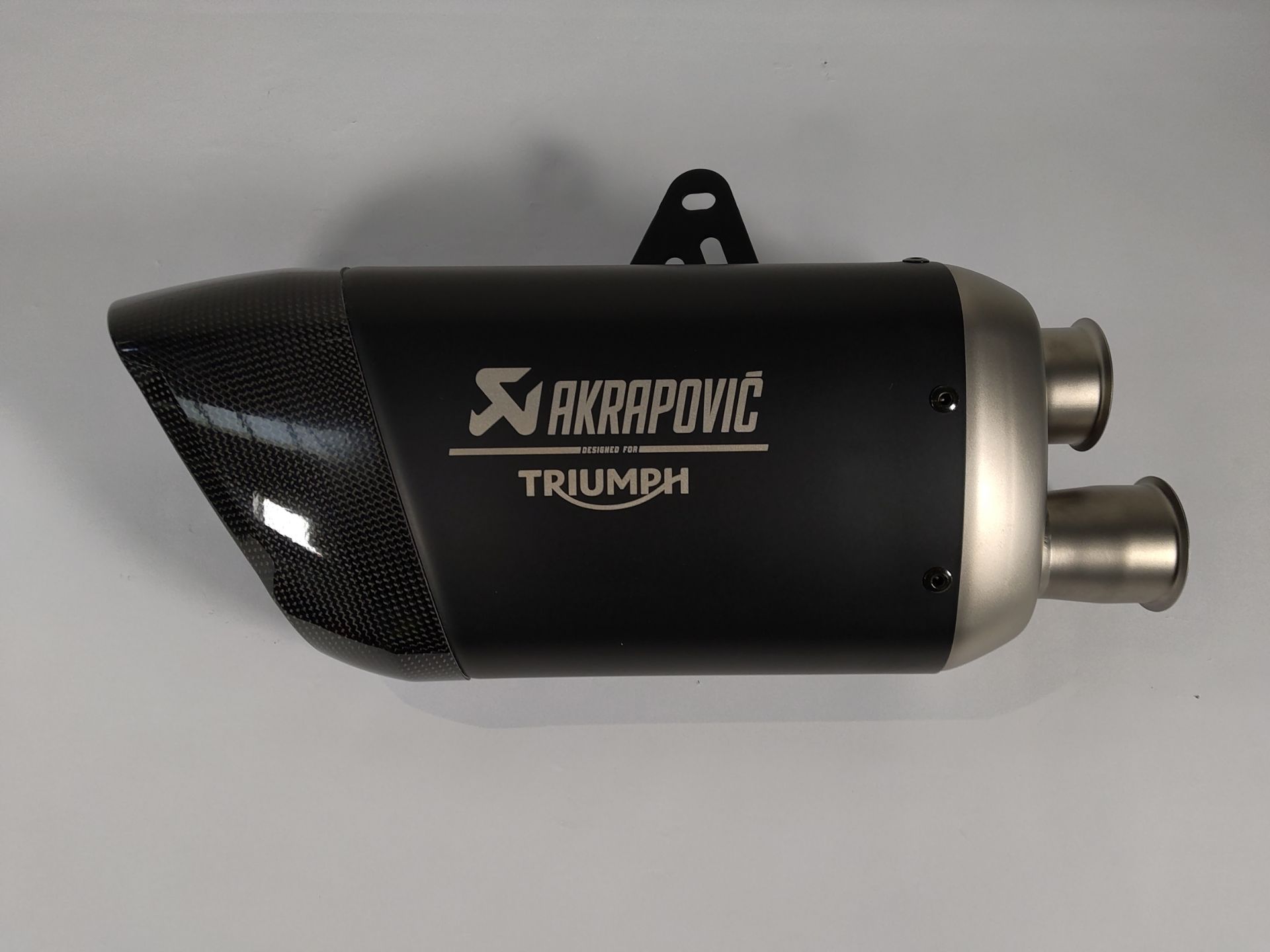 As new Akrapovic titanium slip-on exhaust silencer for Triumph Triple 1200 RS or RR Motorcycle.