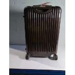 A pre-owned Rimowa polycarbonate shell wheeled suitcase. (H65 - L40).
