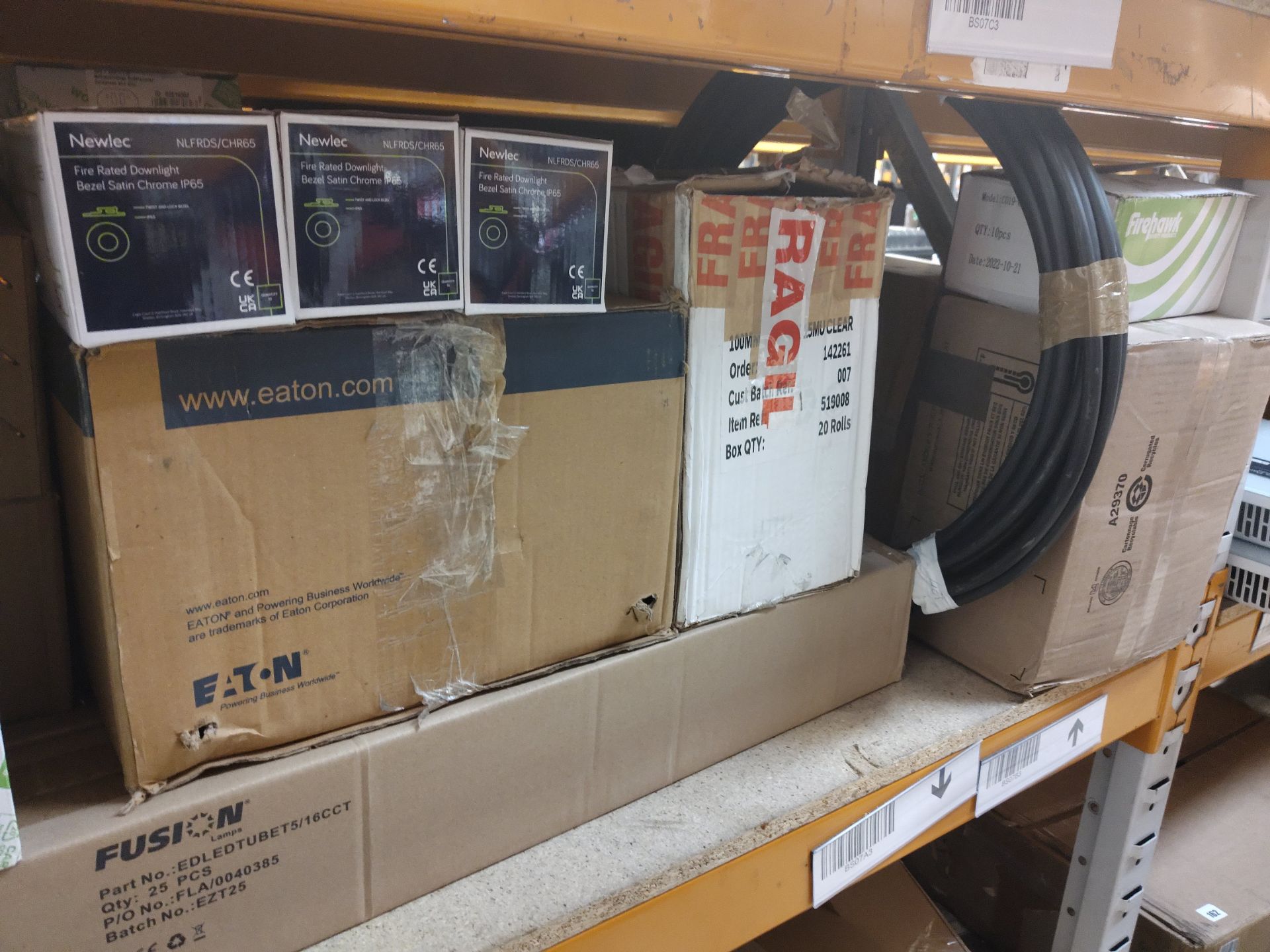 Assorted electrical and plumbing items on three shelves.