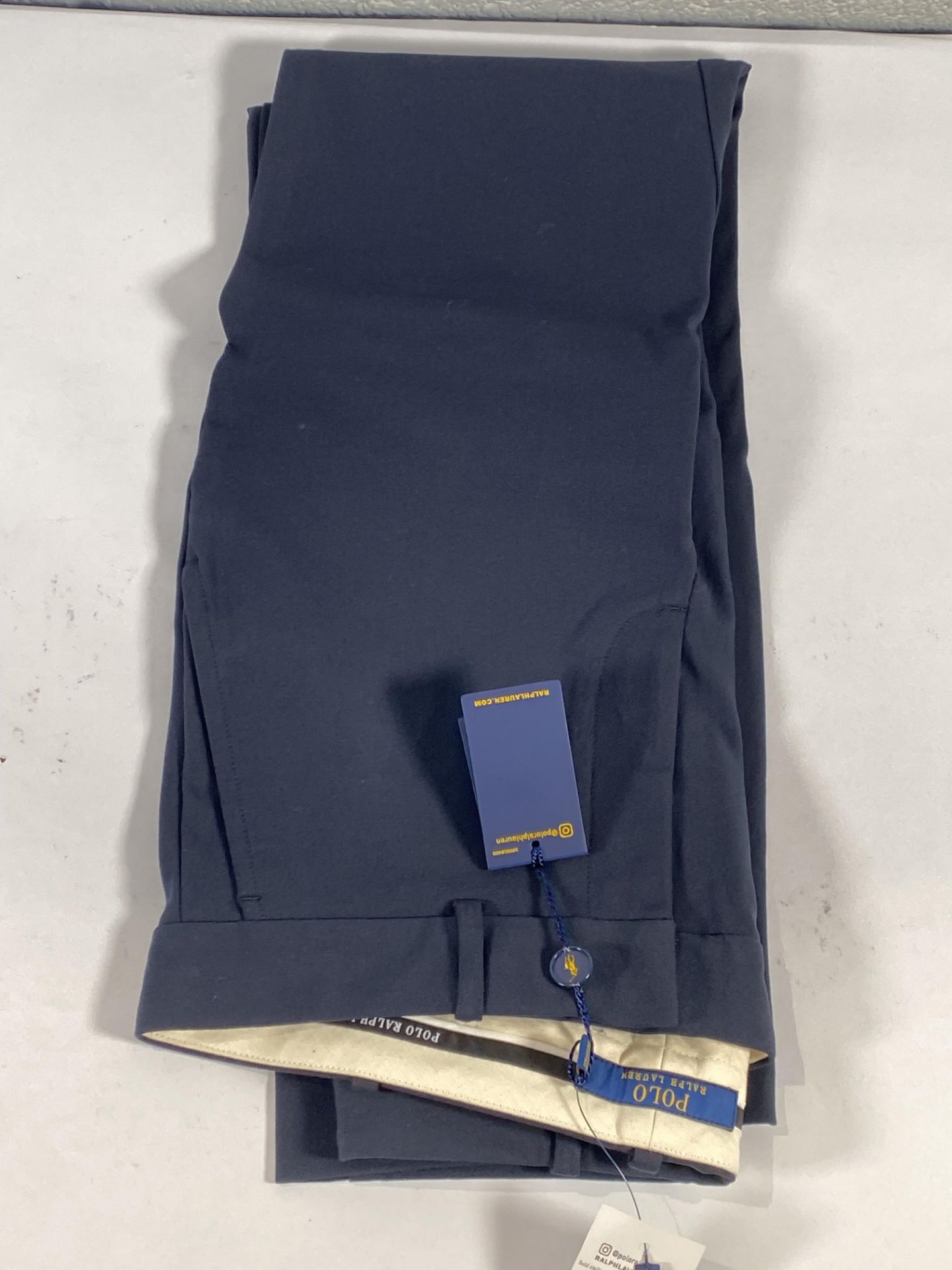 A pair of Ralph Lauren suit trousers (Size 4).