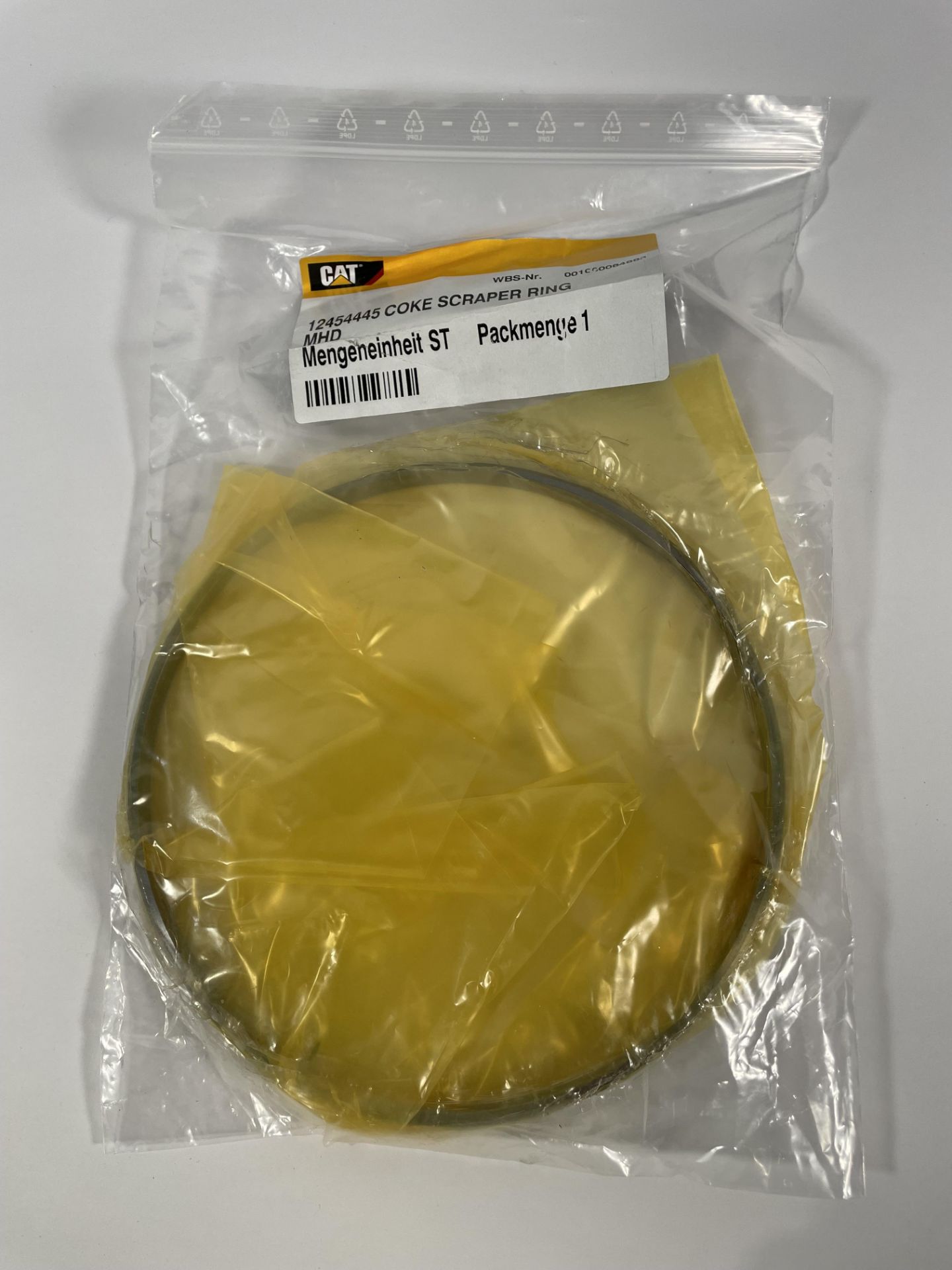 Approximately forty 12454445 Coke Scraper Rings.