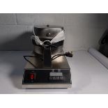 A pre-owned Xeoleo FQ-2205A DZ Waffle baker.