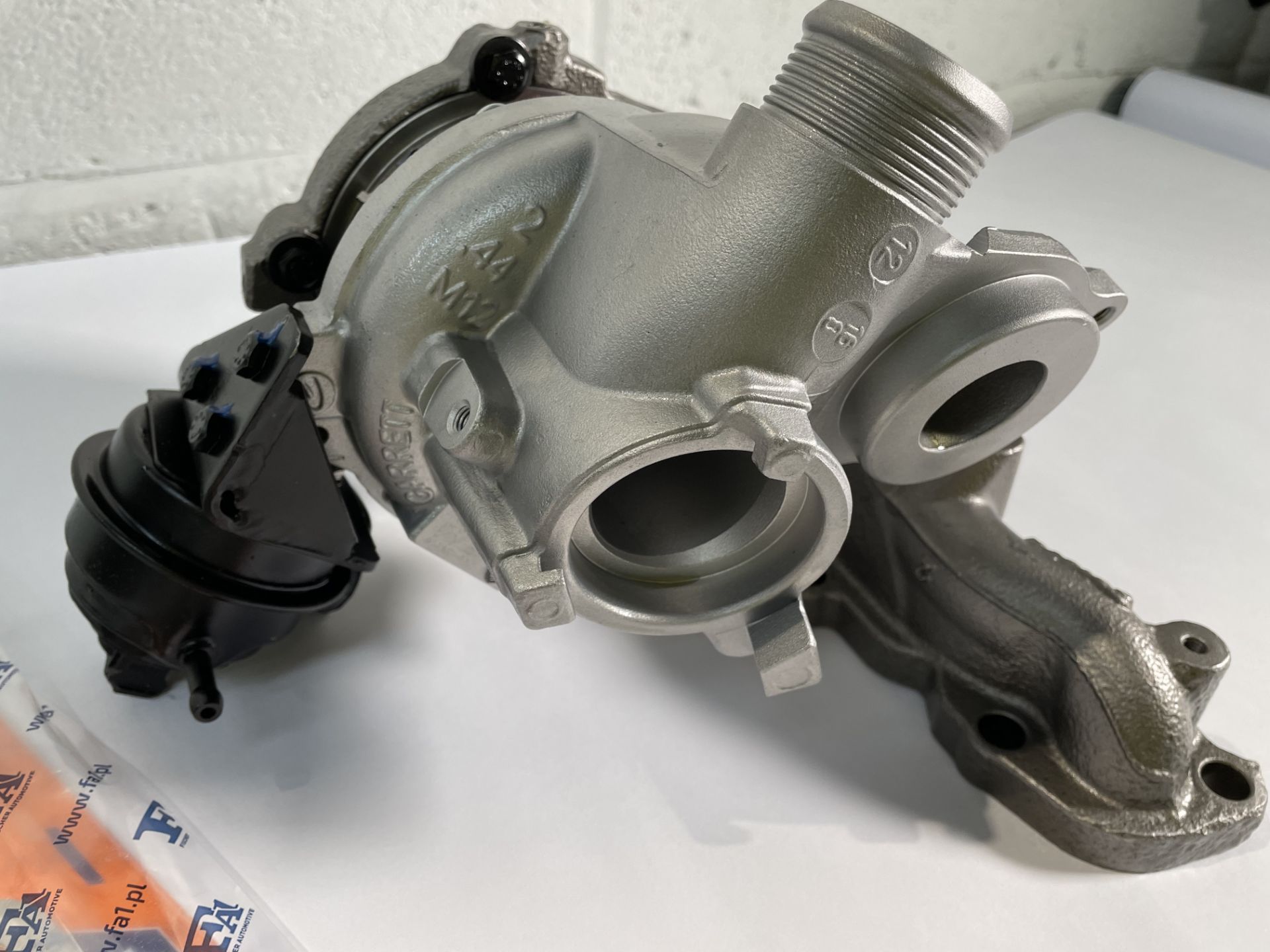 A Carwood Garrett 813860 Turbocharger with some minor damage (sold as seen). - Image 2 of 3