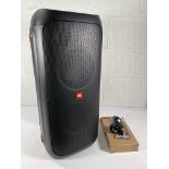 A JBL Partybox 310 (with box and packaging).