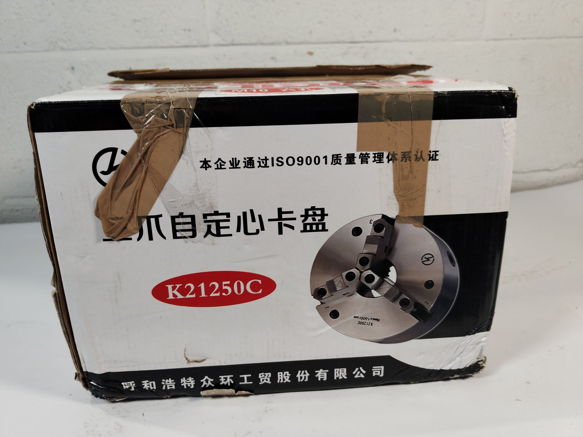 An unbranded three-jaw self-centering chuck lathe chuck (REF: K21250C / M10).