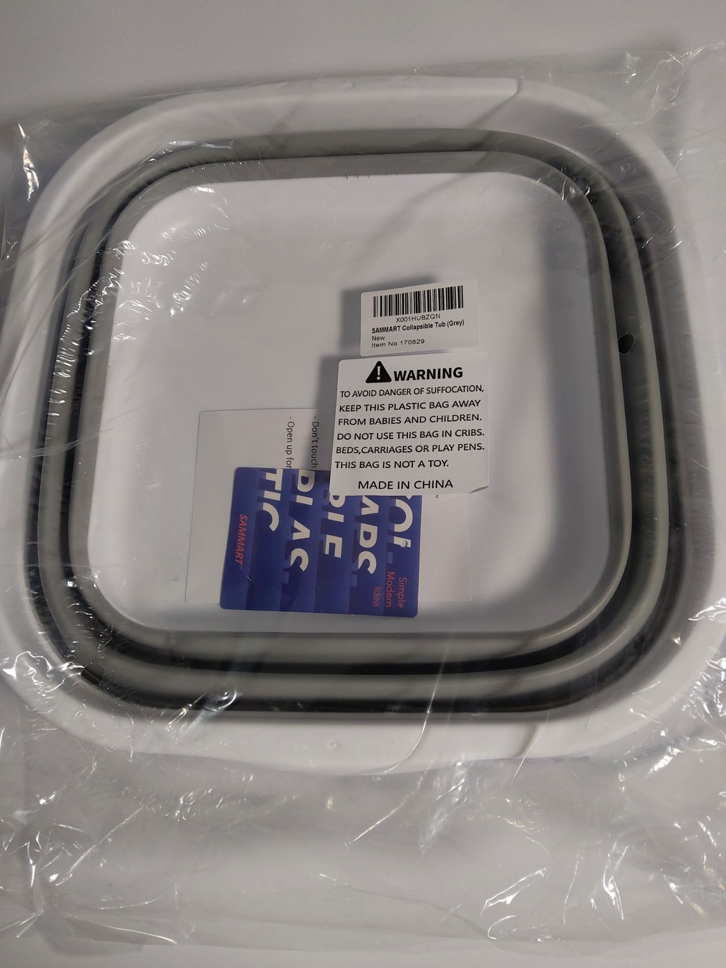 Fourteen Sammart grey collapsible tubs.