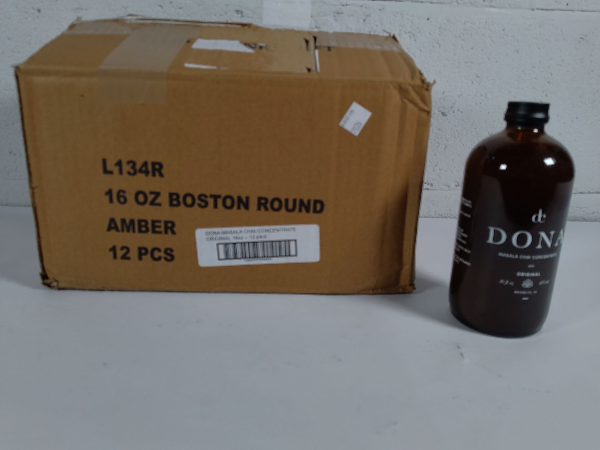 Twelve as new 16 fl oz bottles of dc Dona Masala Chai Concentrate Original flavour. BBE 05/05/26 (Gl