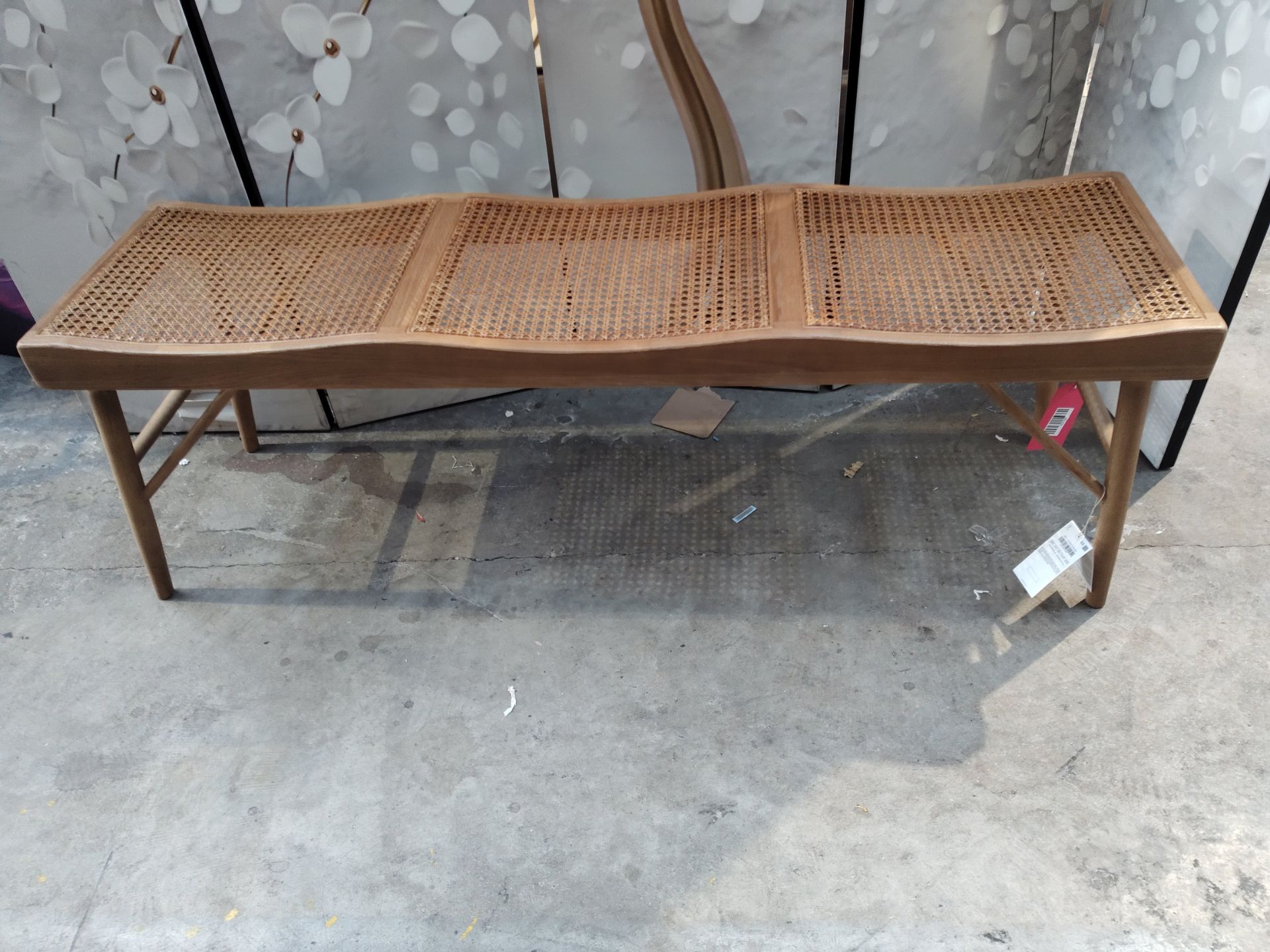 An as new Zara home wood and rattan bench 47 x140 x 39cm (brown).