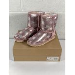 A pair of children's Ugg classic short 2 sequin star boots (UK 3).