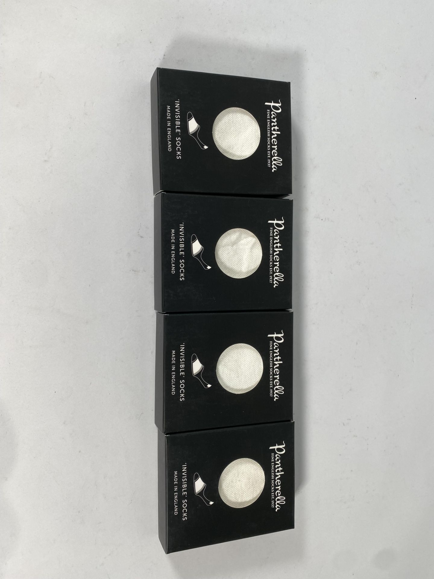 Ten pairs of Panthella invisible socks, size large.