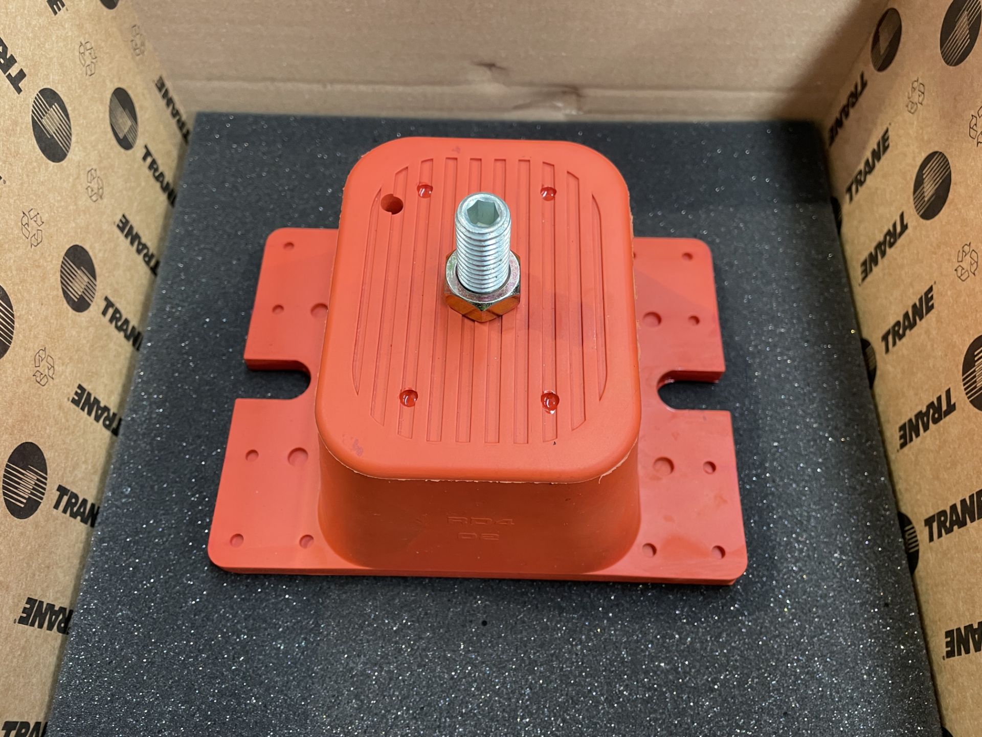Four boxed as new Trane MNT00645 mount/isolators with stud, vibration control, red, durulene.