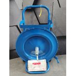 A pre-owned strap dispenser trolley in blue and a pallet strapping tensioner ratchet.