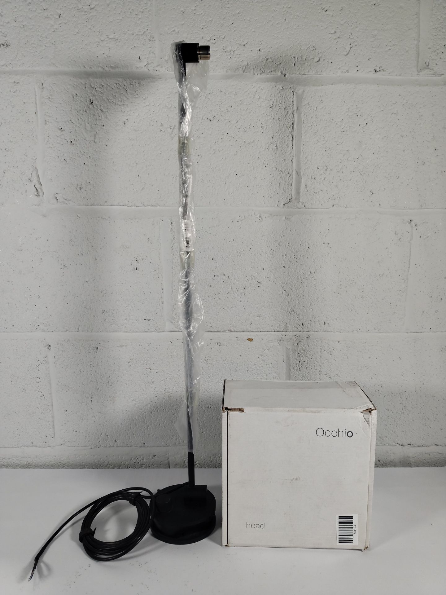 A pre-owned Occhio Sento Tavolo in Matt Black with stand.