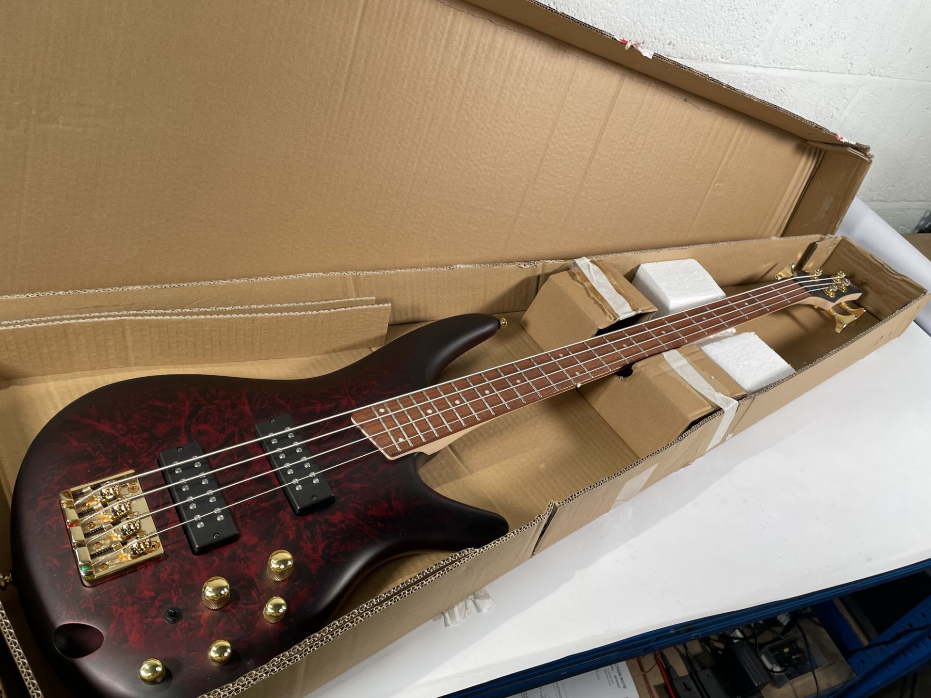 An Ibanez SR300EDX bass, Wine Red Frozen Matte.