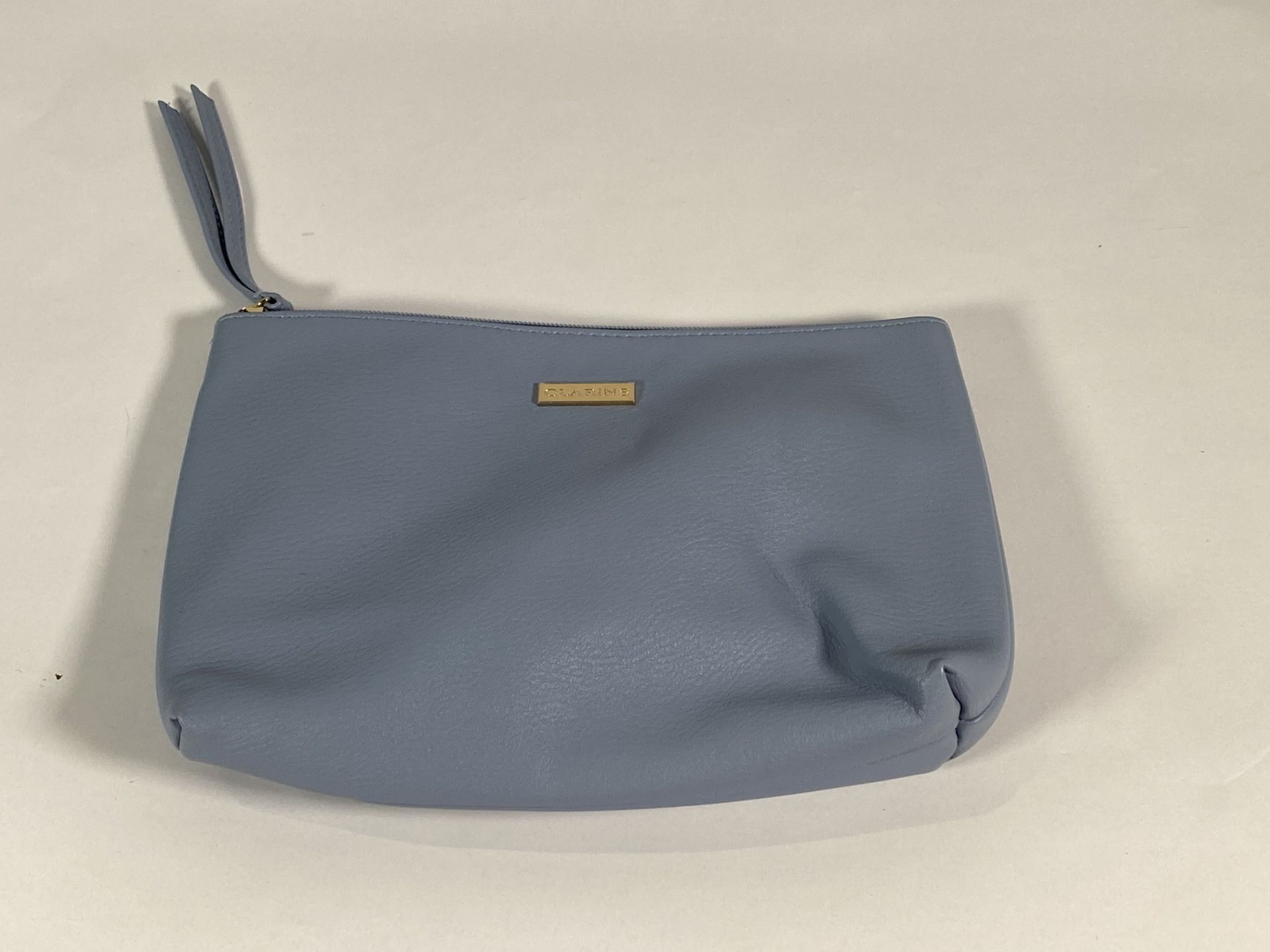 Fifteen Clarins wash bags.