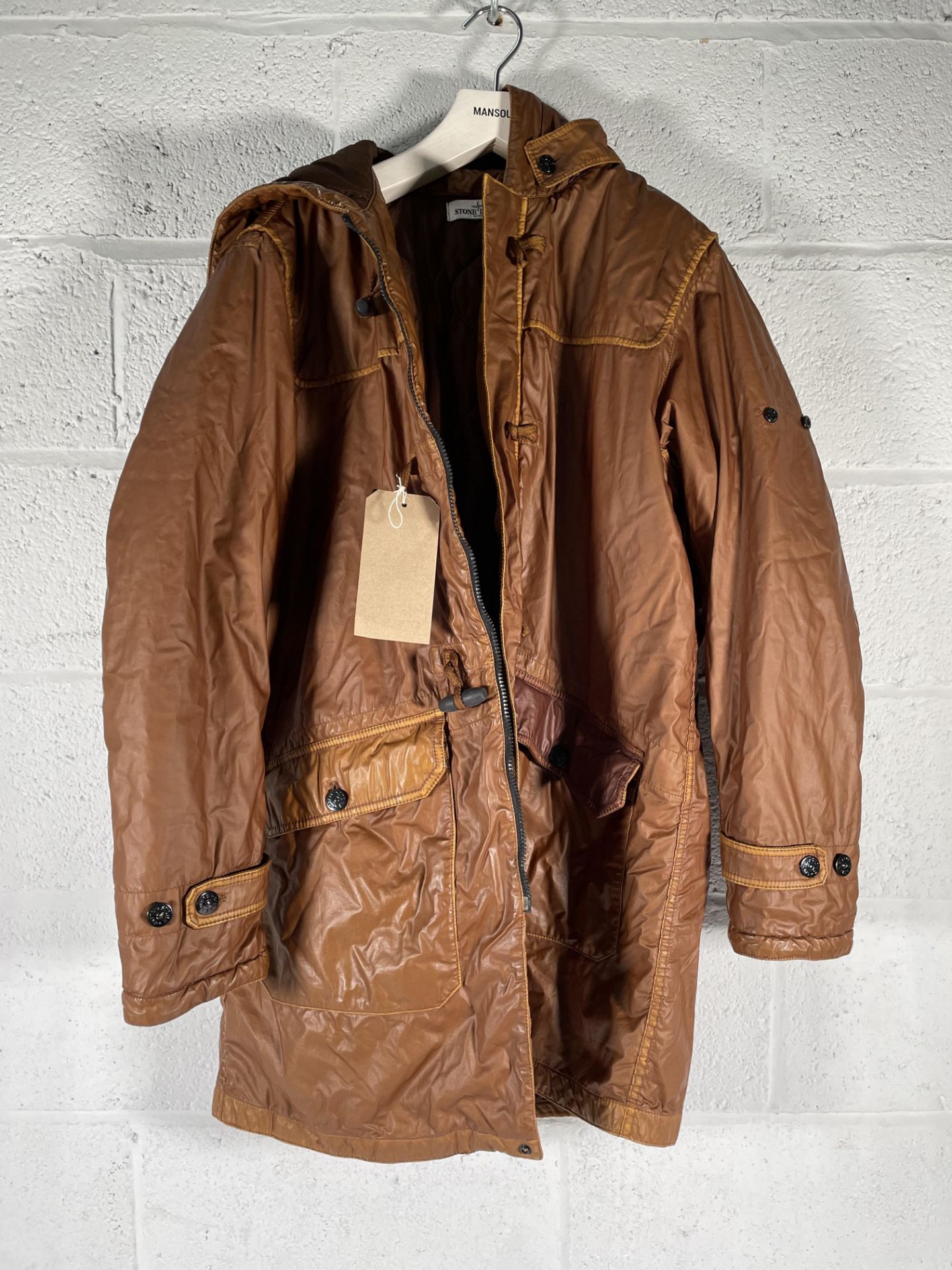 A pre-owned Stone Island Mussola Gommata Compass Patch Long Line Jacket, XXL (arm patch missing).