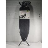 An as new Brabantia Ironing Board B, 124 x 38 cm with steam iron rest, denim black.
