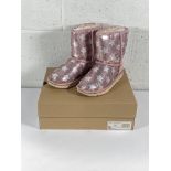 A pair of children's Ugg classic short 2 sequin star boots (UK 3).