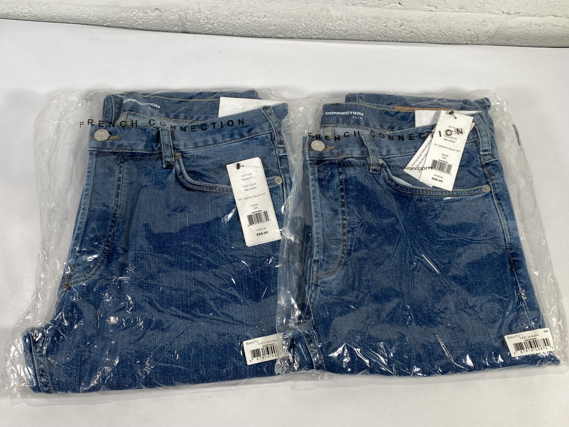 Two pairs of French Connection denim slim fit jeans (Sizes 32 and 34).