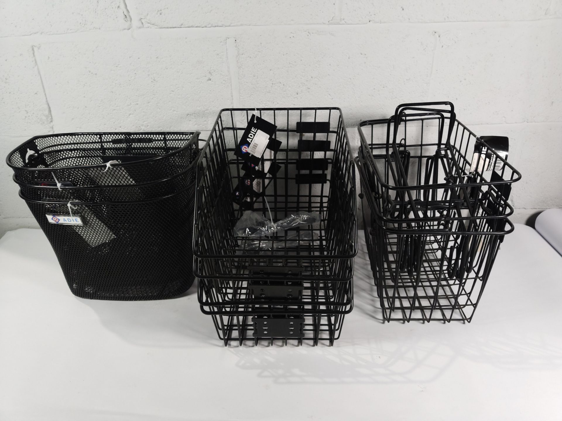 Ten assorted as new Adie wire bicycle baskets.
