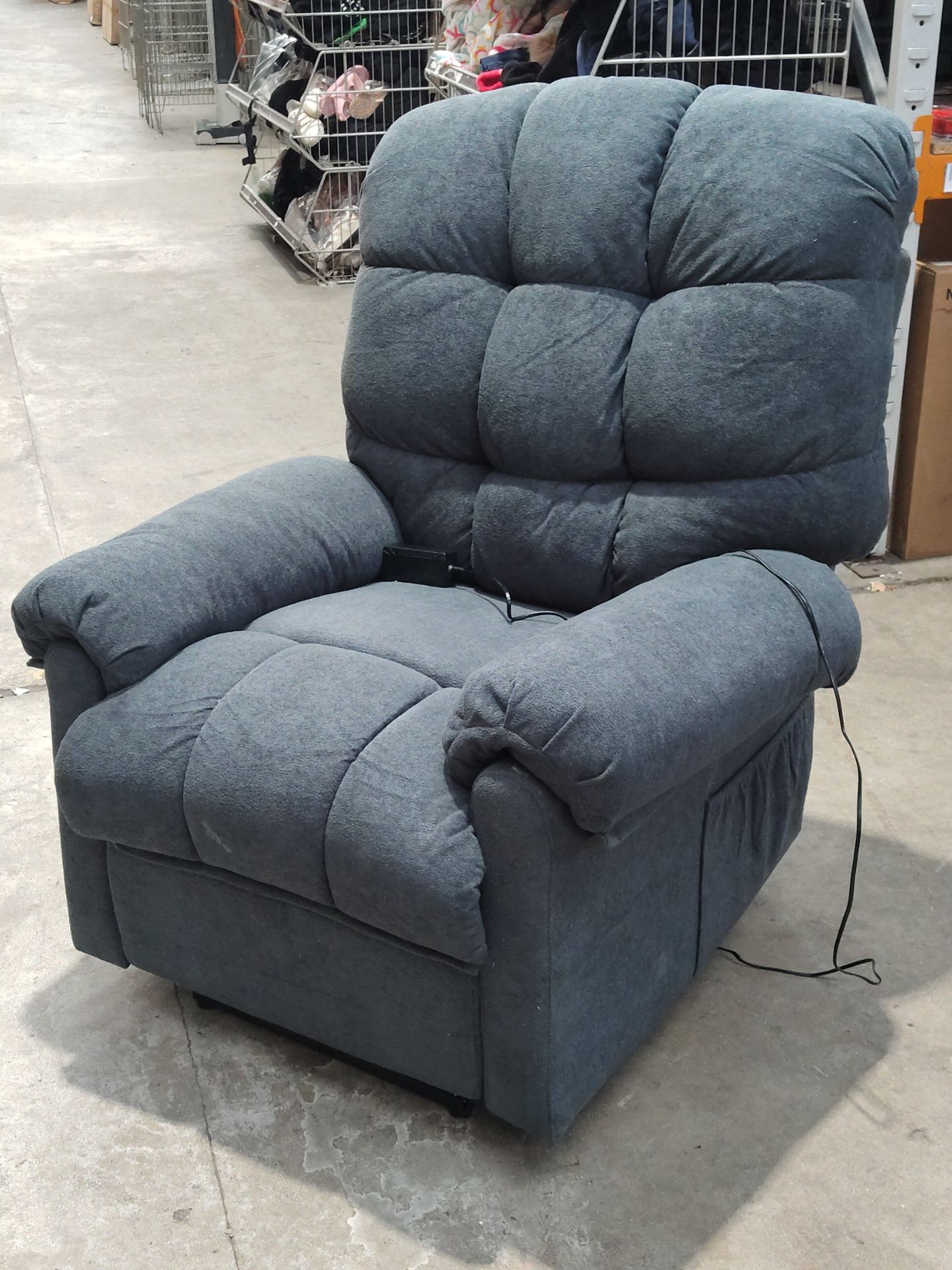 A pre-owned electric reclining chair in blue.