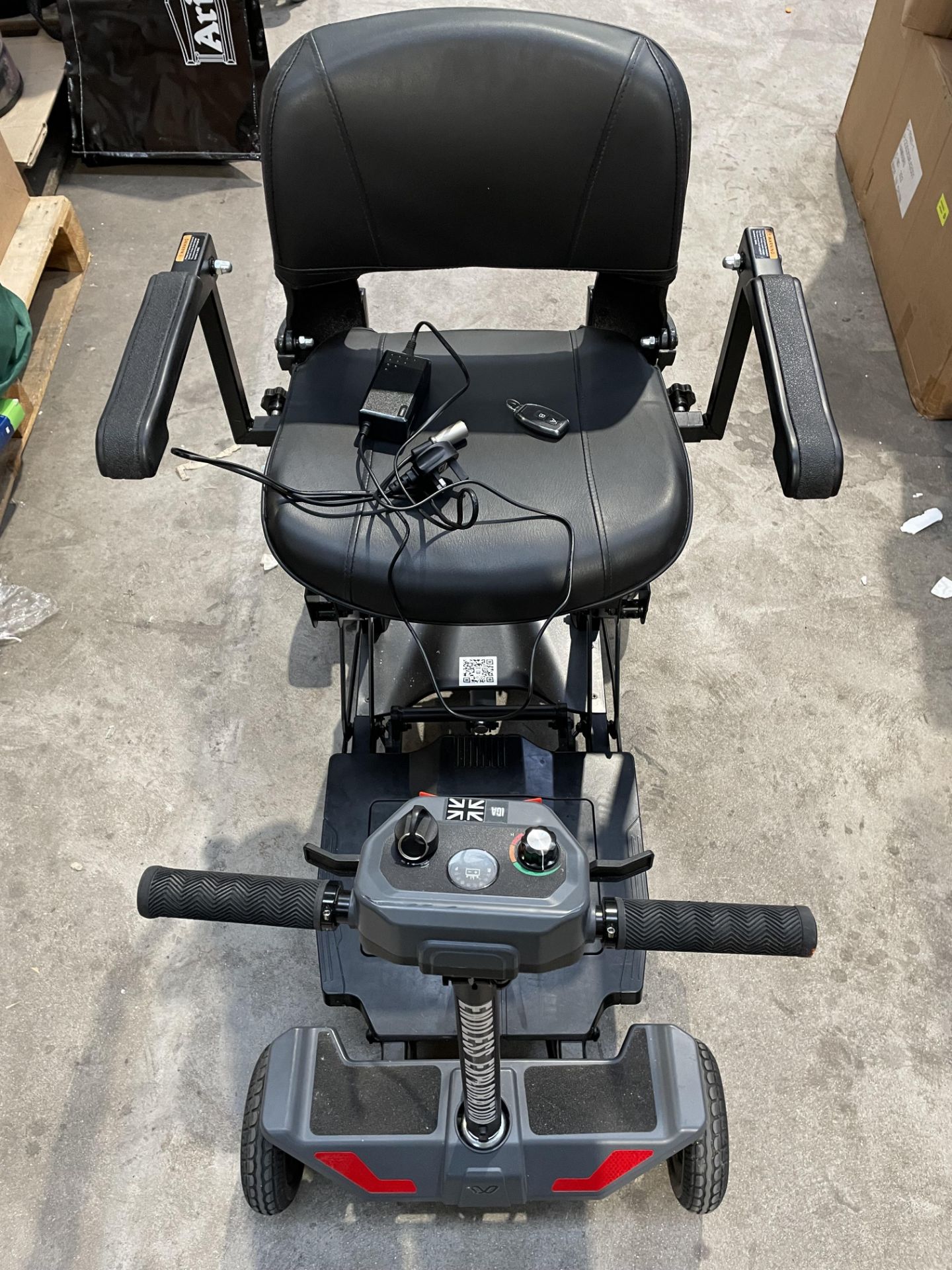 A pre-owned iGlide AutoFolding mobility scooter (working condition).
