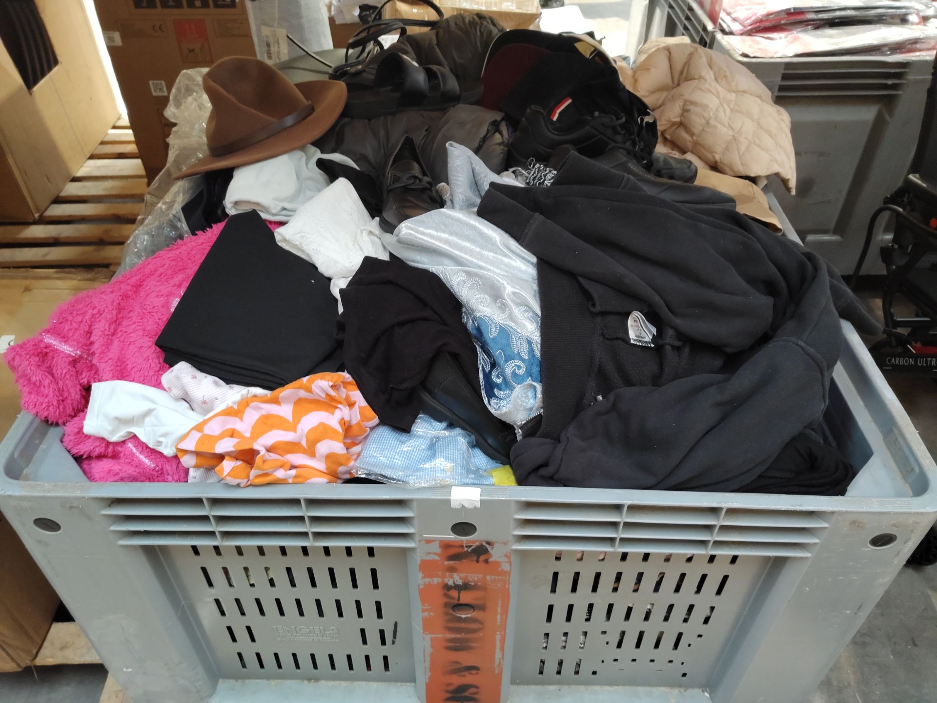 A large quantity of assorted pre-owned clothing and related. (Container not included)